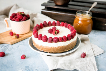 Classic New York cheesecake with raspberries and caramel
