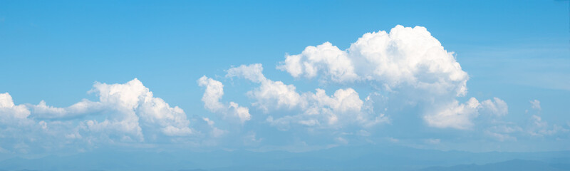 Naklejka na ściany i meble Panorama view of white soft Fluffy clouds and blue sky