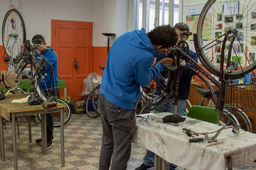 worker in a bicycle repair shop