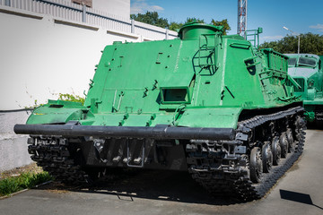 green armored tracked military tractor