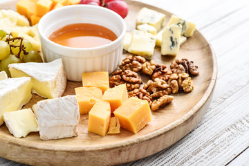 Cheese plate - various types of cheeses with honey