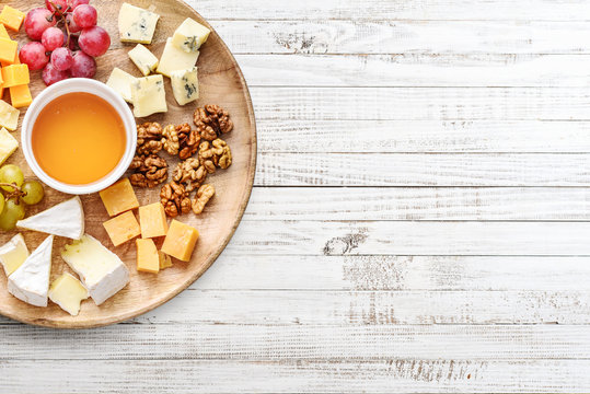 Cheese plate - various types of cheeses with honey