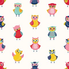 Fototapeta premium Childish seamless pattern with cute wise owls on white background. Backdrop with cartoon forest birds in different postures. Colorful flat vector illustration for wrapping paper, textile print.