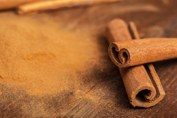 Cinnamon on wooden board.