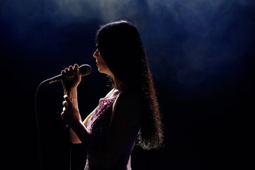 Shadow of singer in light