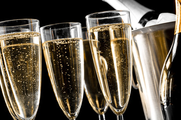 glasses of champagne with a champagne bottle in a bucket