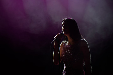 Fototapeta na wymiar close up image of live singer on stage