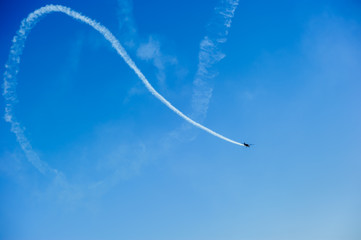Airplanes on aerobatic performs flight and beautiful smoke trail..