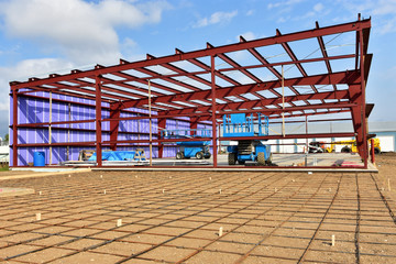 Re inforcement rod and steel framework of commercial building under construction.building under construction. - Powered by Adobe