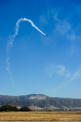 Airplanes on aerobatic performs flight and beautiful smoke trail..
