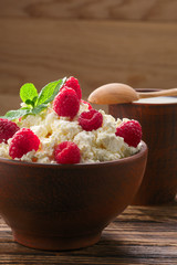 Dairy products: milk, cottage cheese, raspberry and mint. Copy space background