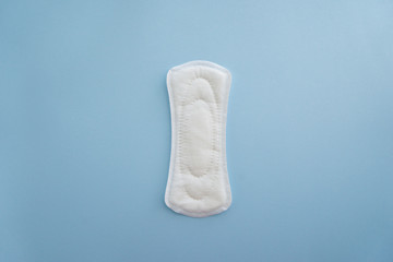 Menstrual pad on color background