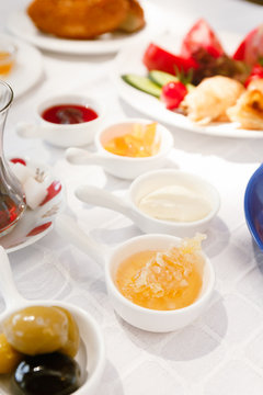 Turkish tea, Honey, Jam,  Olives, Simit. Authentic turkish breakfast. Local cuisine concept