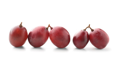 Ripe sweet grapes on white background