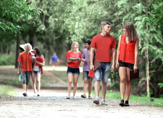 group of friends at park walking and enjoying time all together