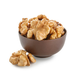 Bowl with shelled walnut on white background