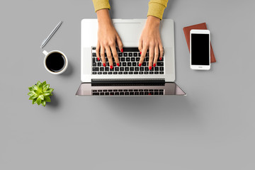Office desktop with laptop and accessories