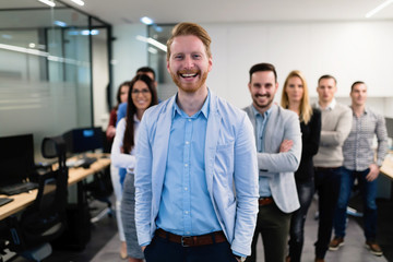 Obraz premium Successful team of young perspective businesspeople in office