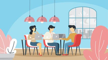 Coworking space with freelance people sitting at the table