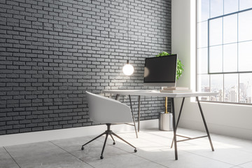Contemporary brick interior with designer workplace