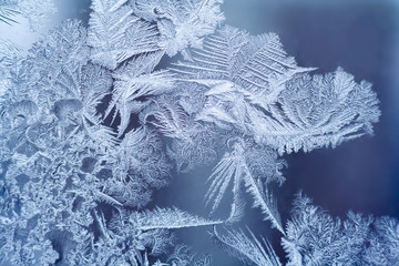 Frosty pattern on the glass window. Abstract, background