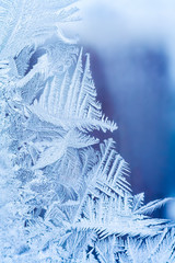 Frosty pattern on the glass window. Abstract view