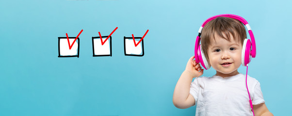 Checklist with toddler boy with headphones on a blue background
