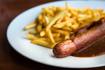 Tasty german sausage served with sauce