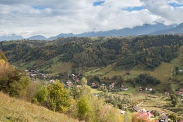 View  of the valley with the villages at the foot of the Carpathian Mountains not far from the city of Bran in Romania