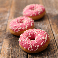pink donut on wood
