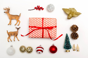 Christmas ornaments with a gift box on a white background