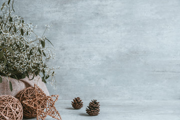 Beautiful christmas composition, pine cones, baubles, star on wooden background. Copy space, greeting card