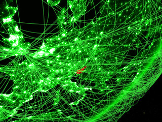 Slovenia on green model of planet Earth with network at night. Concept of green technology, communication and travel.
