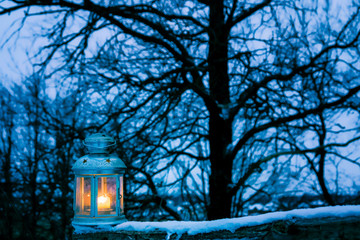 Christmas lantern in garden, winter dark evening landscape. festive winter season, magic scene. Christmas, new year holidays concept. template for design