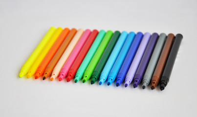 a line of colorful markers/pens
