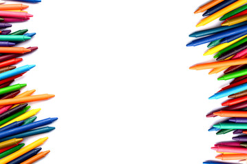 Crayons lined up isolated on white background.