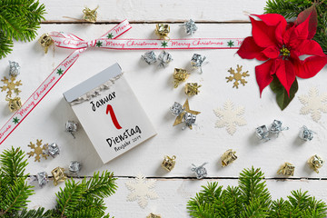 tear-off calendar surrounded by christmas decoration and with the 1st of january 2019 on top