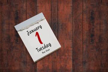 tear-off calendar with 1st of january 2019 on wooden background