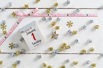 tear-off calendar surrounded by christmas decoration and with the 1st of january 2019 on top