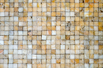 Golden shiny ceramic tile texture background