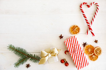 Christmas mood concept. Layout composition with traditional festive attributes, green decorative fresh pine tree branches. Winter holidays season. Background, copy space, close up, top view, flat lay.