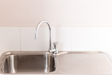 Faucet sink at kitchen