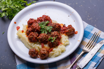 Tasty details of tomato meatballs with mash