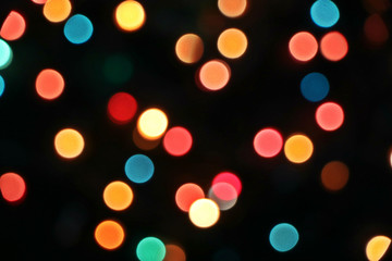 New Year and Christmas concept. Bokeh. Lights from the garland..