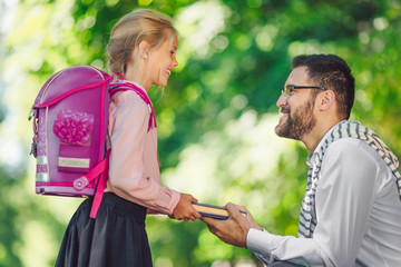 Little schoolgirl with father