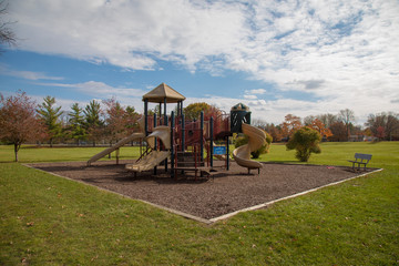 Obraz na płótnie Canvas play structure at a city park on a bright fall day