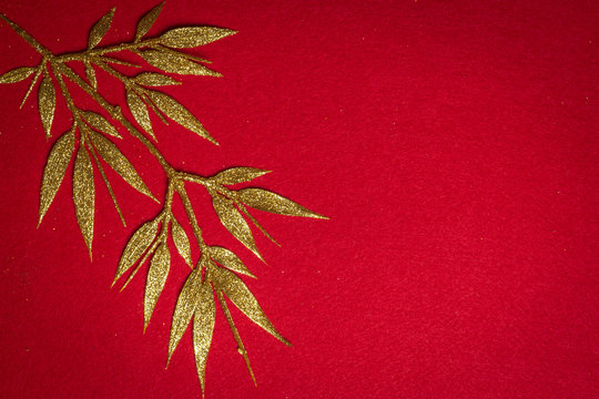 Golden Tree Leaves On Red Flannel Background, Top View Design