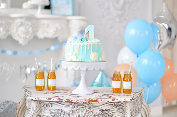 One year birthday decorations. Decorations for holiday party. A lot of balloons blue and white colors. 
