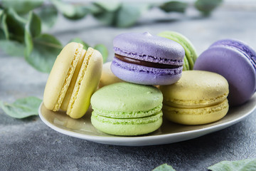 Beautiful heart of pink rose petals, letters cubes love and cup of coffee isolated on white marble background. Valentines Day concept. Closee-up