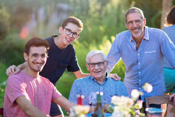 During a family picnic. Portrait of three generation of men